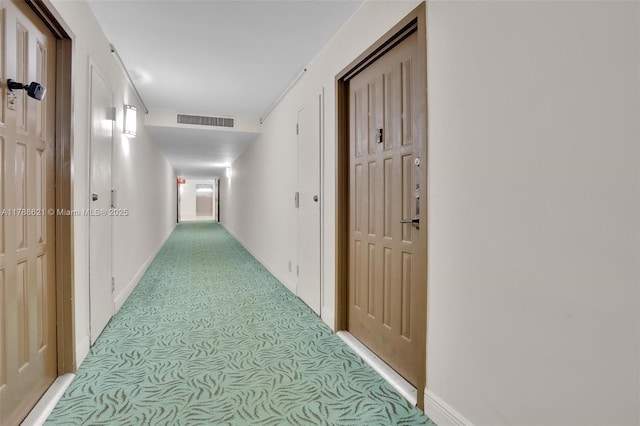 600 Parkview Dr Unit 422, Hallandale Beach, FL 33009 - corridor featuring visible vents, baseboards, and light carpet
