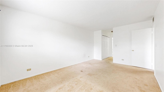 8101 SW 72nd Ave Unit 304W, Miami, FL 33143 - spare room with light carpet and baseboards