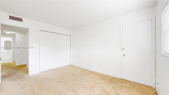 8101 SW 72nd Ave Unit 304W, Miami, FL 33143 - unfurnished bedroom with carpet flooring and a closet