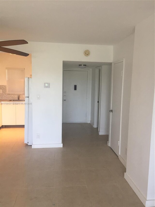 1701 Washington St Unit 503, Hollywood, FL 33020 - kitchen with dishwasher, white cabinetry, and tasteful backsplash