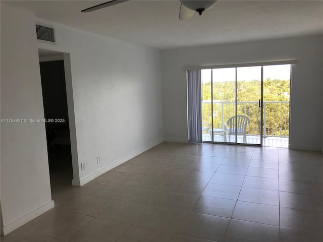 1701 Washington St Unit 503, Hollywood, FL 33020 - unfurnished room with a ceiling fan, tile patterned flooring, and baseboards