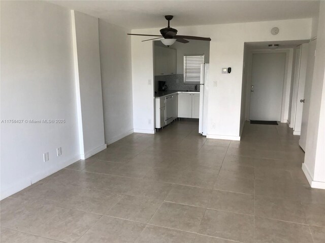 1701 Washington St Unit 503, Hollywood, FL 33020 - tiled empty room featuring ceiling fan and baseboards