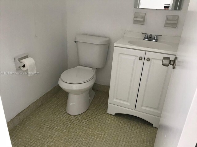 1701 Washington St Unit 503, Hollywood, FL 33020 - half bath with toilet, vanity, and baseboards
