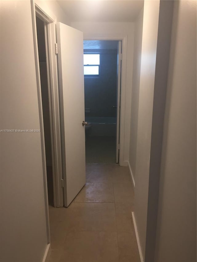 1701 Washington St Unit 503, Hollywood, FL 33020 - corridor featuring light tile patterned flooring and baseboards