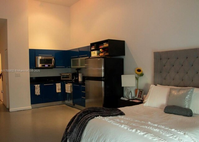 253 NE 2nd St Unit 324, Miami, FL 33132 - bedroom featuring freestanding refrigerator