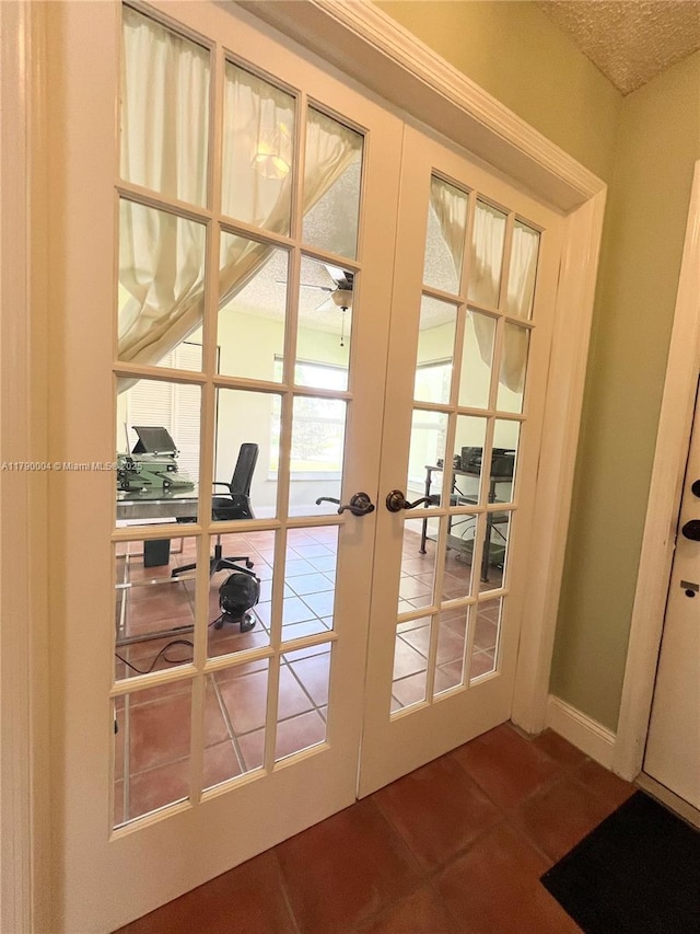 9271 Arborwood Cir, Davie, FL 33328 - doorway to outside with french doors, a desk, tile patterned floors, and a textured ceiling