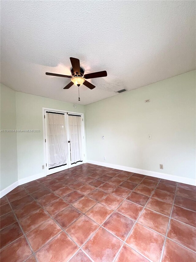 9271 Arborwood Cir, Davie, FL 33328 - unfurnished room with a ceiling fan, a textured ceiling, and tile patterned floors
