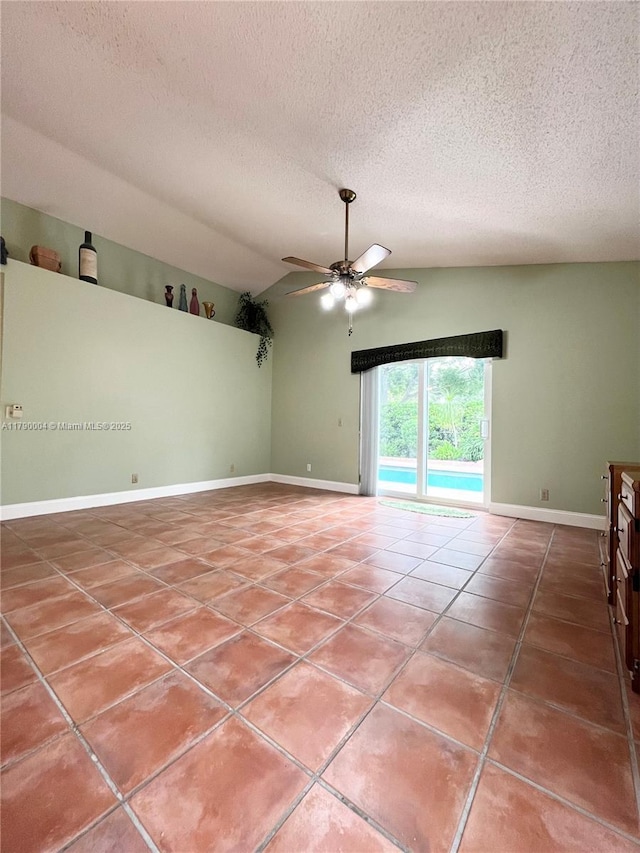 9271 Arborwood Cir, Davie, FL 33328 - tiled empty room with a textured ceiling, a ceiling fan, and vaulted ceiling