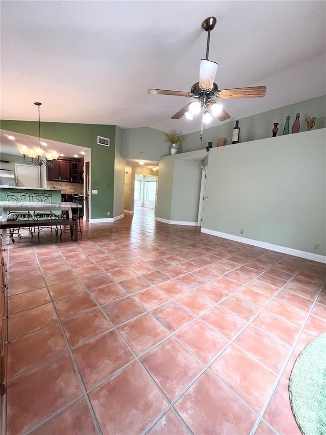 9271 Arborwood Cir, Davie, FL 33328 - unfurnished living room with tile patterned floors, vaulted ceiling, ceiling fan, and a chandelier