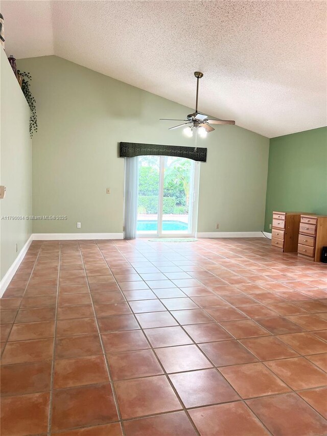 9271 Arborwood Cir, Davie, FL 33328 - spare room featuring vaulted ceiling, ceiling fan, a textured ceiling, and tile patterned flooring