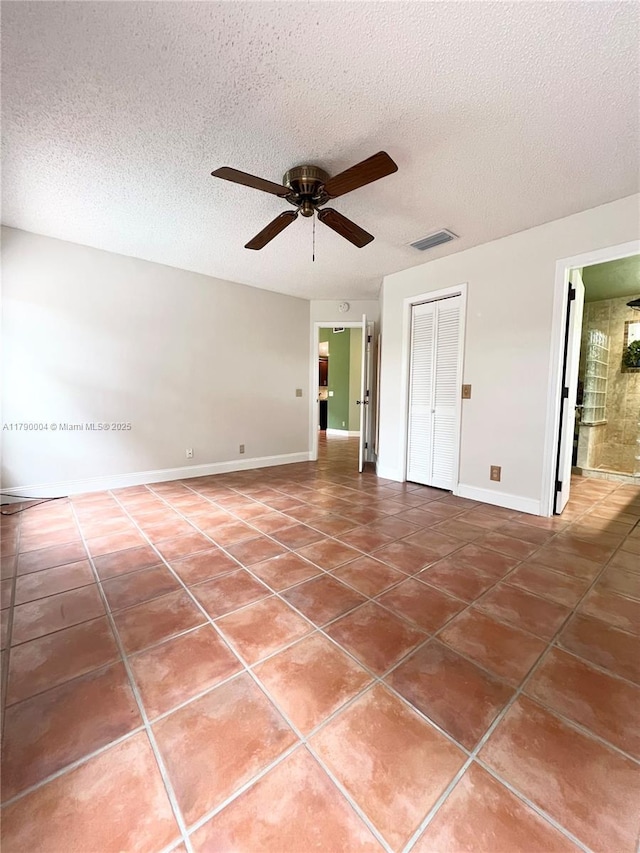 9271 Arborwood Cir, Davie, FL 33328 - tiled spare room featuring ceiling fan and a textured ceiling