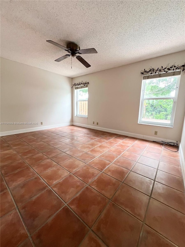 9271 Arborwood Cir, Davie, FL 33328 - empty room featuring tile patterned floors, a ceiling fan, and a textured ceiling