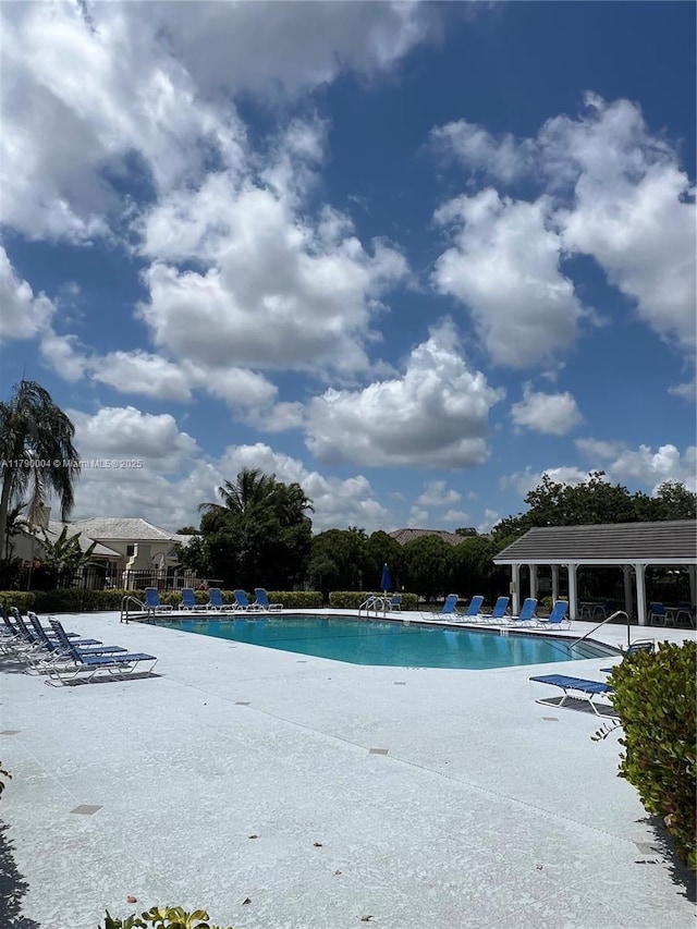 9271 Arborwood Cir, Davie, FL 33328 - community pool featuring a patio