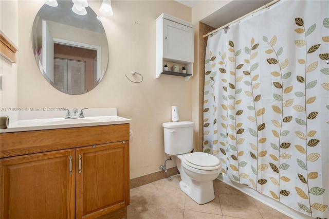 bathroom featuring curtained shower, baseboards, toilet, tile patterned floors, and vanity