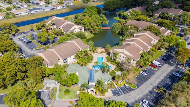bird's eye view featuring a residential view and a water view