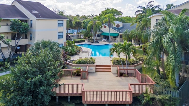 community pool with a deck