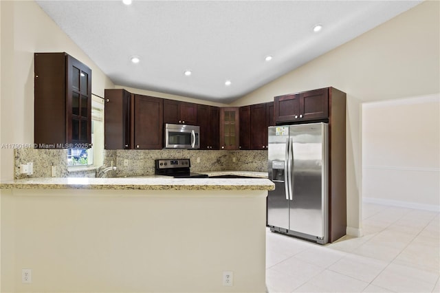 kitchen with decorative backsplash, appliances with stainless steel finishes, a peninsula, glass insert cabinets, and recessed lighting
