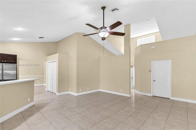 3562 W Southern Orchard Rd W, Davie, FL 33328 - unfurnished living room featuring high vaulted ceiling, a ceiling fan, washer / clothes dryer, light tile patterned flooring, and recessed lighting