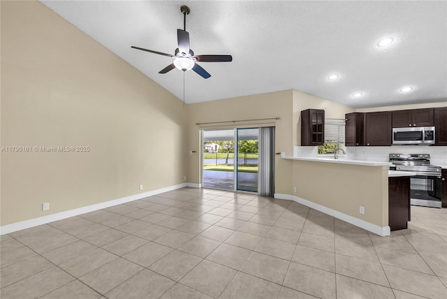 3562 W Southern Orchard Rd W, Davie, FL 33328 - kitchen featuring appliances with stainless steel finishes, a ceiling fan, light tile patterned floors, dark brown cabinets, and light countertops