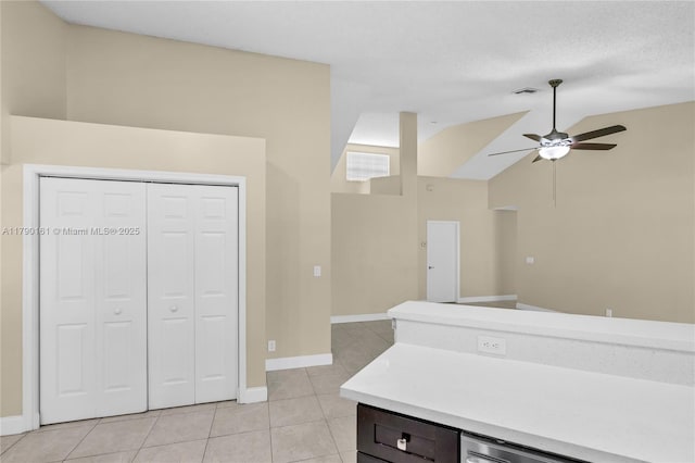 3562 W Southern Orchard Rd W, Davie, FL 33328 - kitchen with light tile patterned floors, light countertops, a ceiling fan, lofted ceiling, and open floor plan