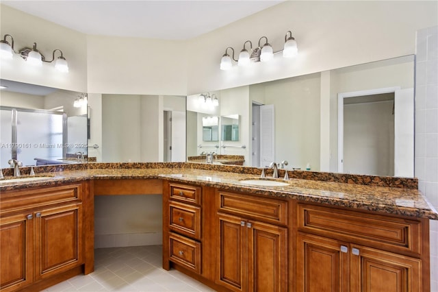 full bathroom featuring a shower stall, tile patterned flooring, and vanity