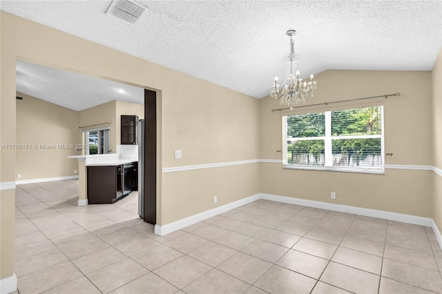 3562 W Southern Orchard Rd W, Davie, FL 33328 - spare room featuring vaulted ceiling, a chandelier, light tile patterned flooring, and a textured ceiling