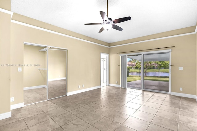 3562 W Southern Orchard Rd W, Davie, FL 33328 - unfurnished room with a ceiling fan, tile patterned floors, and a water view