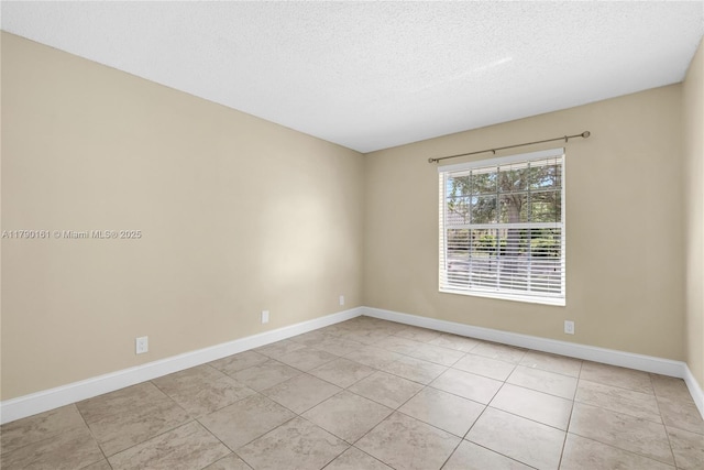 3562 W Southern Orchard Rd W, Davie, FL 33328 - unfurnished room featuring a textured ceiling and light tile patterned flooring