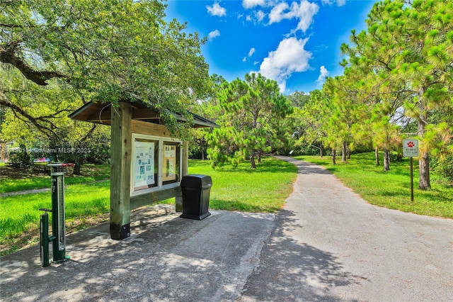 3562 W Southern Orchard Rd W, Davie, FL 33328 - view of property's community featuring a lawn and view of wooded area