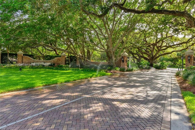 3562 W Southern Orchard Rd W, Davie, FL 33328 - empty room with lofted ceiling, a ceiling fan, and light tile patterned floors
