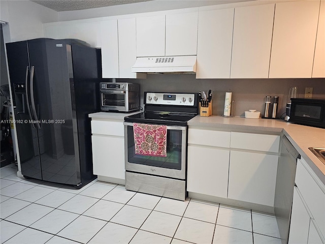 9401 NW 14th Ct Unit 224, Pembroke Pines, FL 33024 - kitchen featuring light countertops, white cabinetry, under cabinet range hood, and black appliances