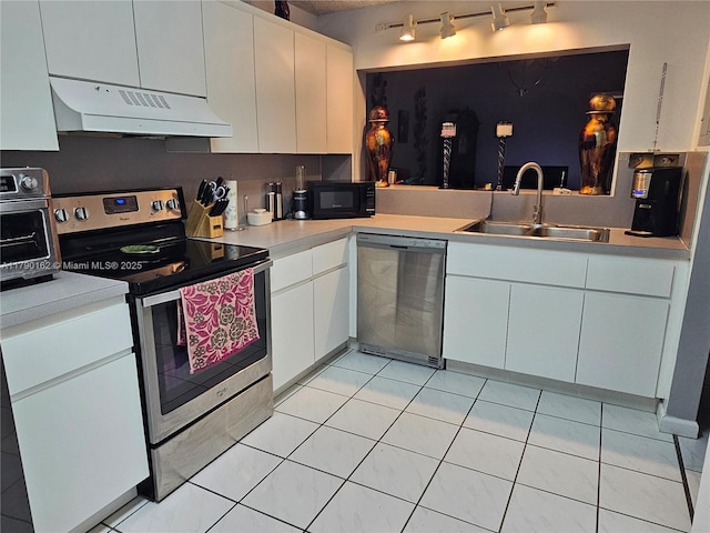 9401 NW 14th Ct Unit 224, Pembroke Pines, FL 33024 - kitchen featuring light countertops, ventilation hood, stainless steel appliances, and a sink