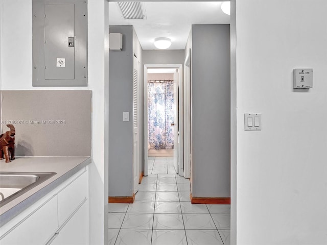 9401 NW 14th Ct Unit 224, Pembroke Pines, FL 33024 - corridor with visible vents, electric panel, baseboards, and light tile patterned floors