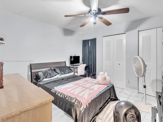 9401 NW 14th Ct Unit 224, Pembroke Pines, FL 33024 - bedroom with two closets, ceiling fan, and light tile patterned floors