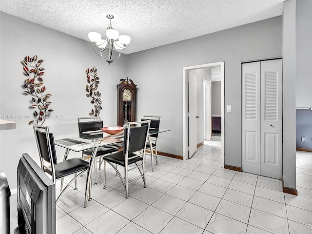 9401 NW 14th Ct Unit 224, Pembroke Pines, FL 33024 - dining area featuring baseboards, a textured ceiling, and a notable chandelier