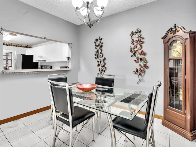 9401 NW 14th Ct Unit 224, Pembroke Pines, FL 33024 - dining room featuring a textured ceiling and a notable chandelier