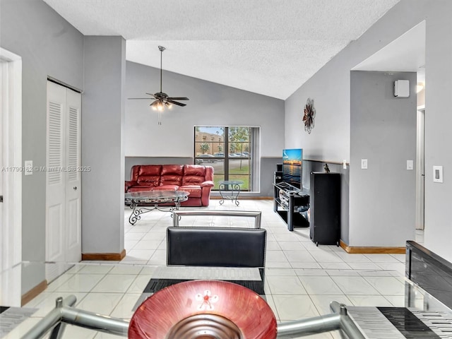 9401 NW 14th Ct Unit 224, Pembroke Pines, FL 33024 - living area featuring lofted ceiling, a textured ceiling, a ceiling fan, and baseboards