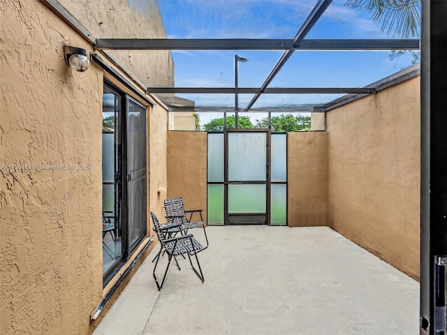 9401 NW 14th Ct Unit 224, Pembroke Pines, FL 33024 - view of patio featuring glass enclosure