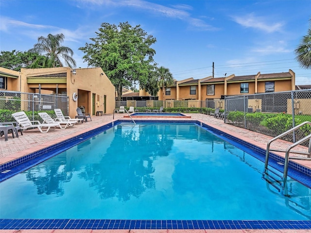 9401 NW 14th Ct Unit 224, Pembroke Pines, FL 33024 - community pool featuring a patio area, a hot tub, and fence