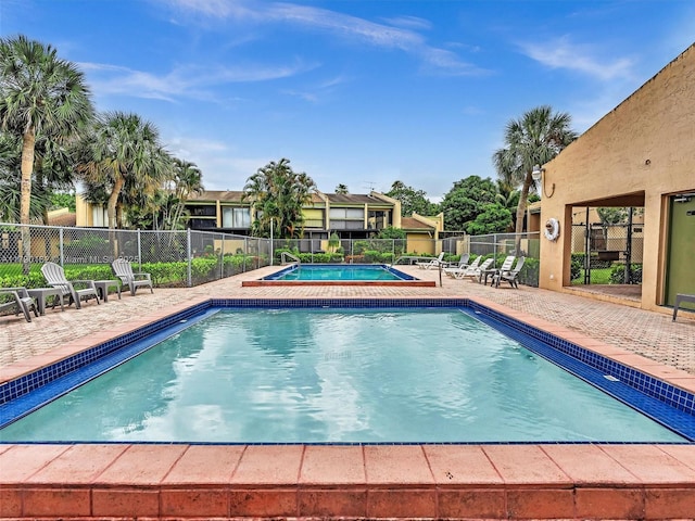 9401 NW 14th Ct Unit 224, Pembroke Pines, FL 33024 - community pool with a patio area and fence