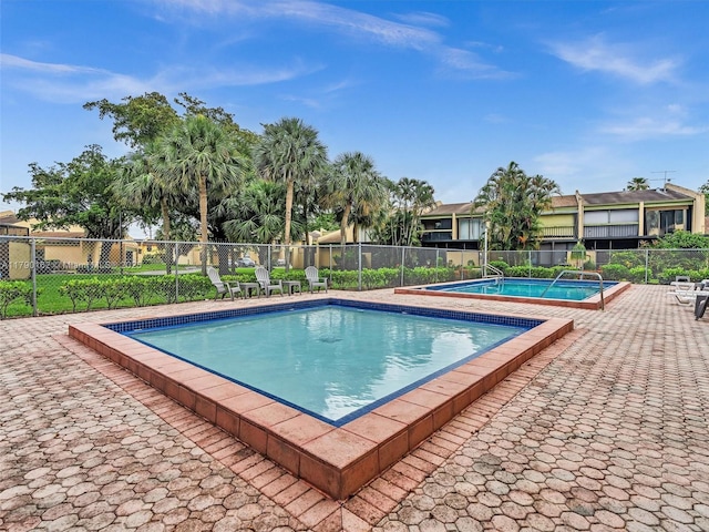 9401 NW 14th Ct Unit 224, Pembroke Pines, FL 33024 - pool featuring fence and a patio area