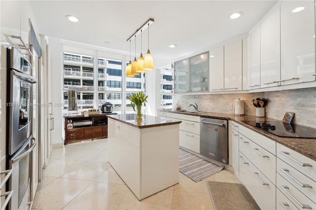 10225 Collins Ave Unit 904, Bal Harbour, FL 33154 - kitchen with backsplash, stainless steel dishwasher, black electric stovetop, and a sink