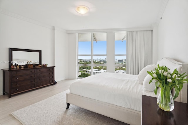 10225 Collins Ave Unit 904, Bal Harbour, FL 33154 - bedroom with baseboards, wood finished floors, and crown molding