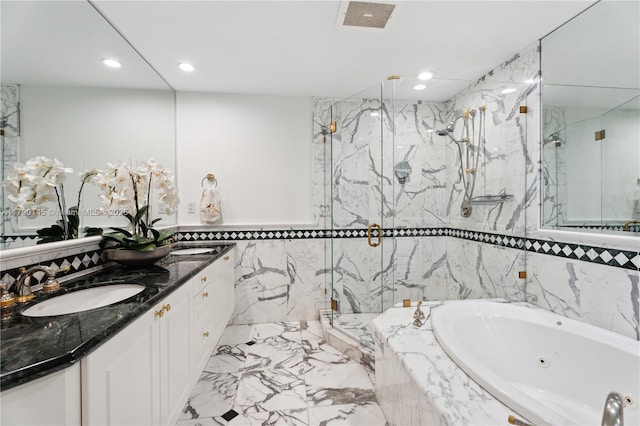 10225 Collins Ave Unit 904, Bal Harbour, FL 33154 - bathroom featuring double vanity, a whirlpool tub, a marble finish shower, tile walls, and recessed lighting