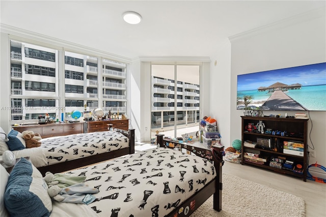 10225 Collins Ave Unit 904, Bal Harbour, FL 33154 - bedroom featuring crown molding and a wall of windows