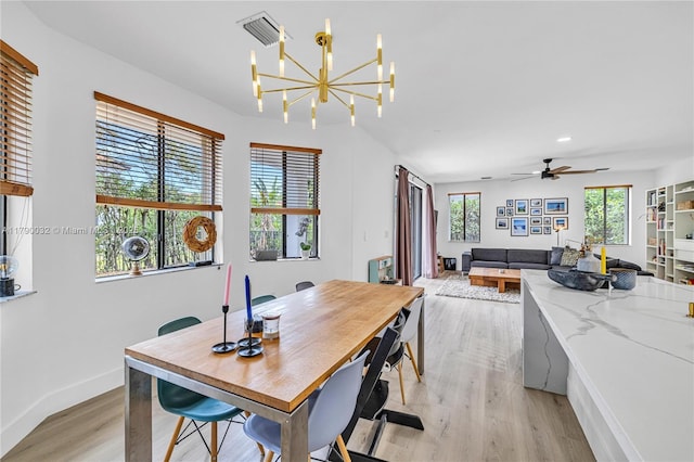dining room with visible vents, light wood-style floors, baseboards, recessed lighting, and ceiling fan with notable chandelier