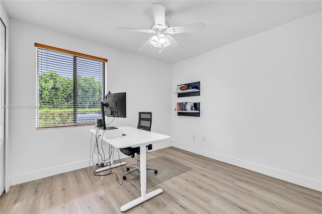 office with a ceiling fan, wood finished floors, and baseboards