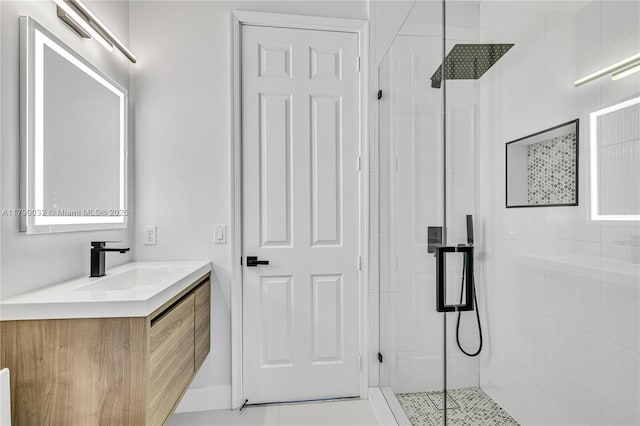 full bathroom featuring a stall shower and vanity