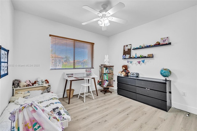 bedroom with baseboards, wood finished floors, and a ceiling fan