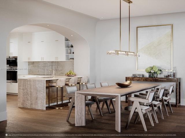 504 Malaga Ave Unit F14, Coral Gables, FL 33134 - dining room with recessed lighting, wood finished floors, and arched walkways